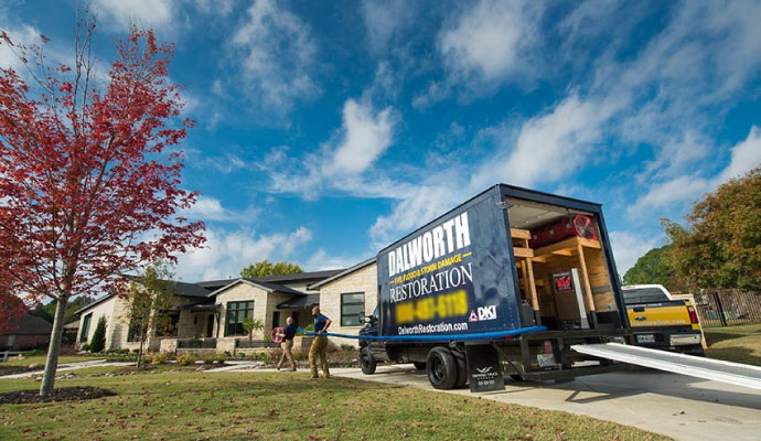 Dalworth restoration service vehicle with team