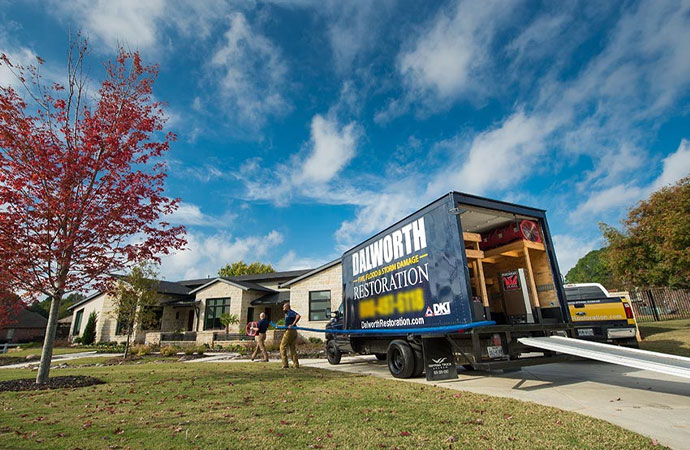 Dalworth Restoration team with service vehicle