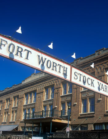The historic sign for the Fort Worth Stock Yards in Texas, showcasing the entrance to the famous cattle drive and cultural area