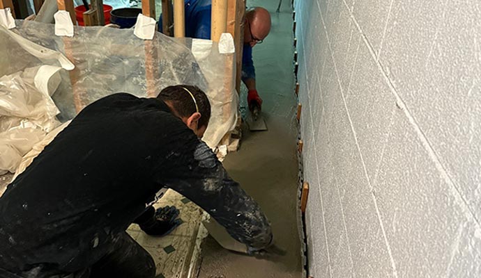 Basement water proofing service in progress
