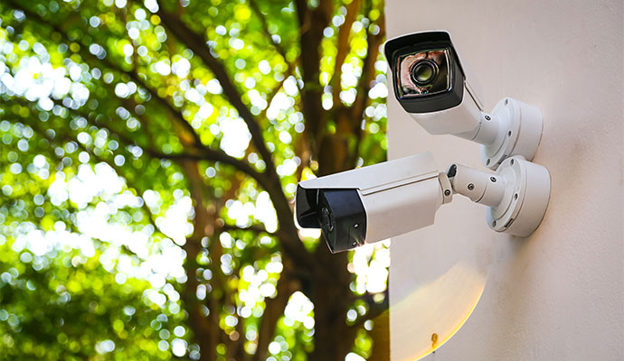 Two security cameras installed on wall